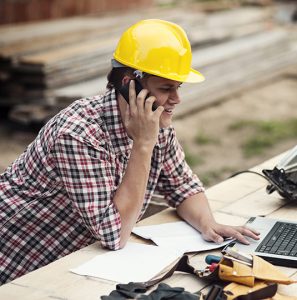 Renovation Contractor on phone working