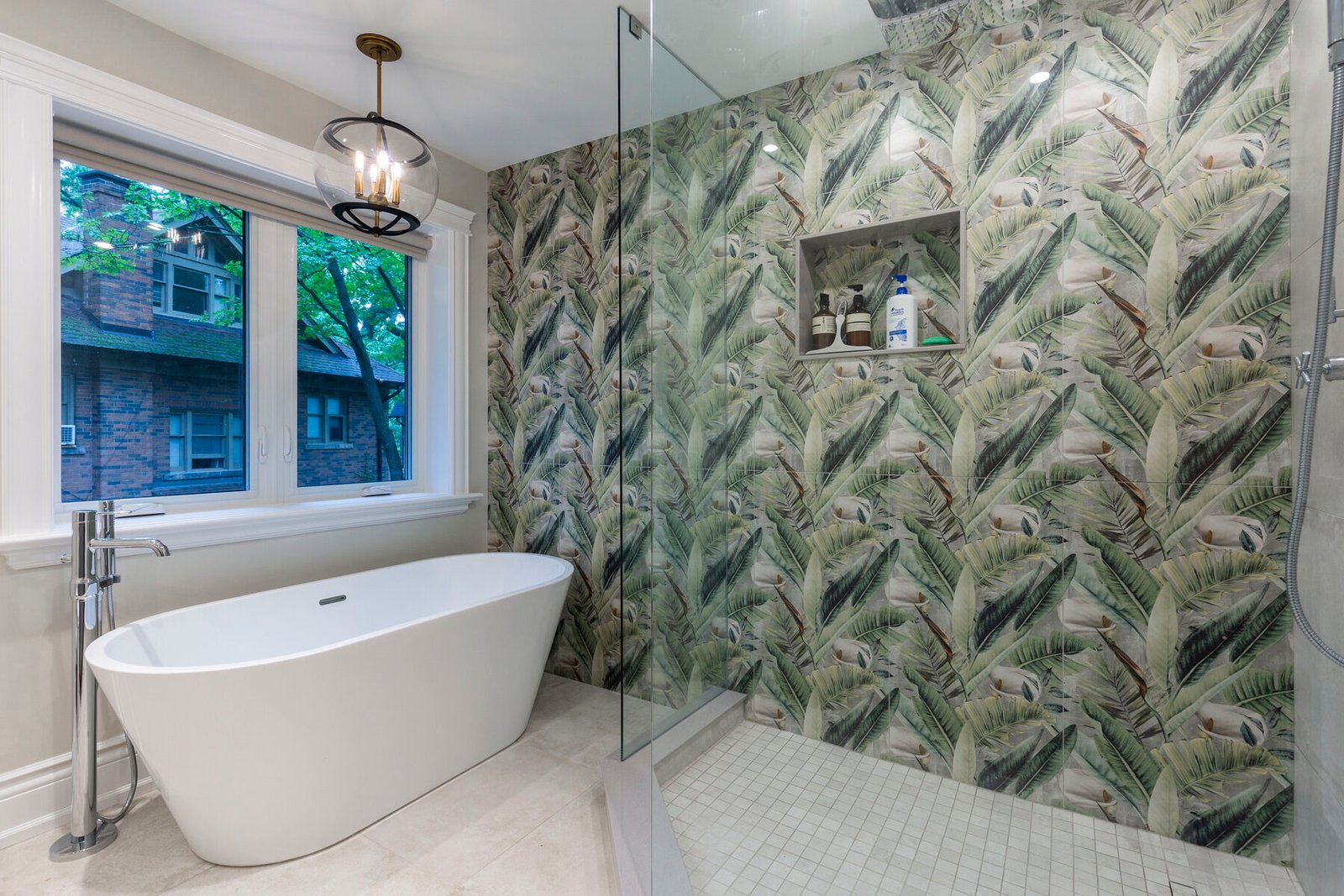 Bathroom with freestanding tub and patterned tile shower
