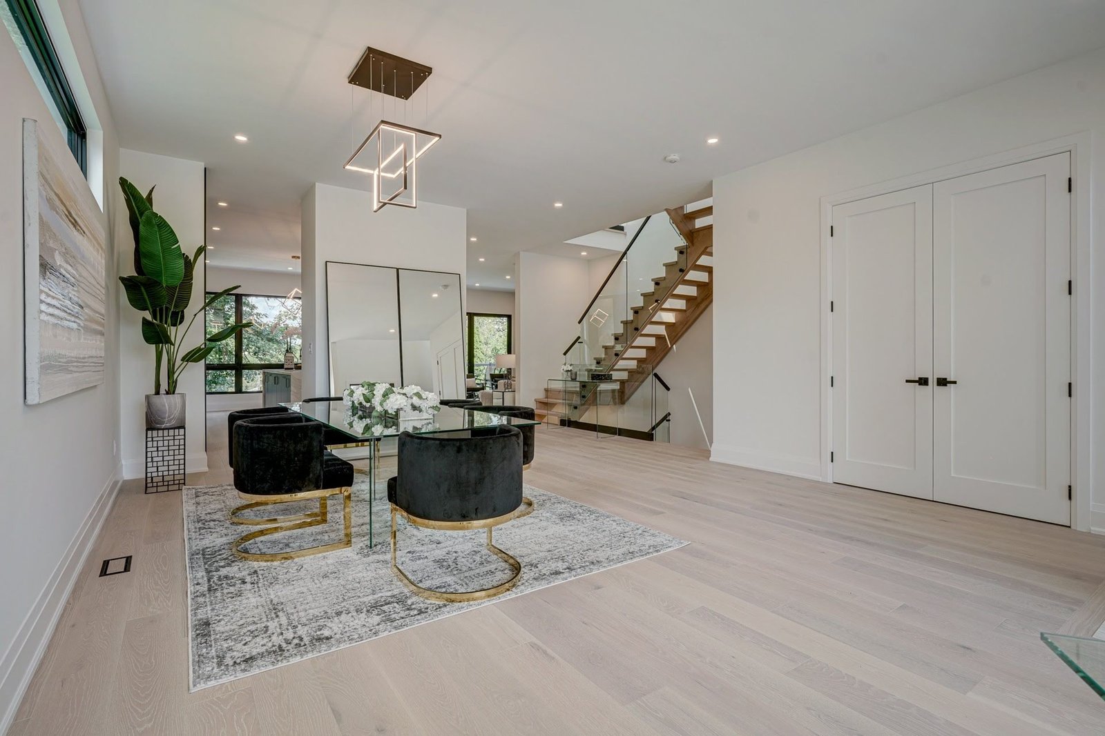 Foyer and open main floor with stairs