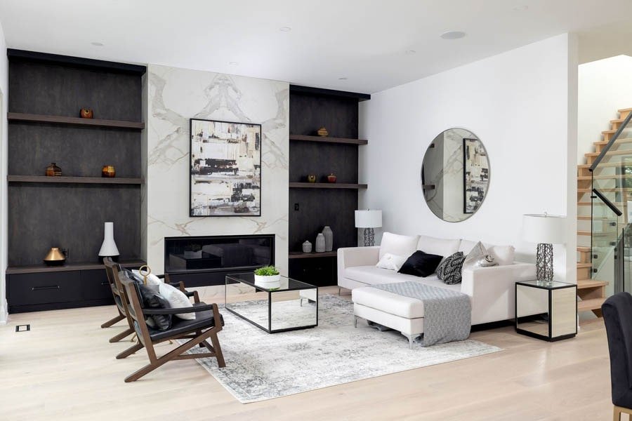 Living room with fireplace and black shelving