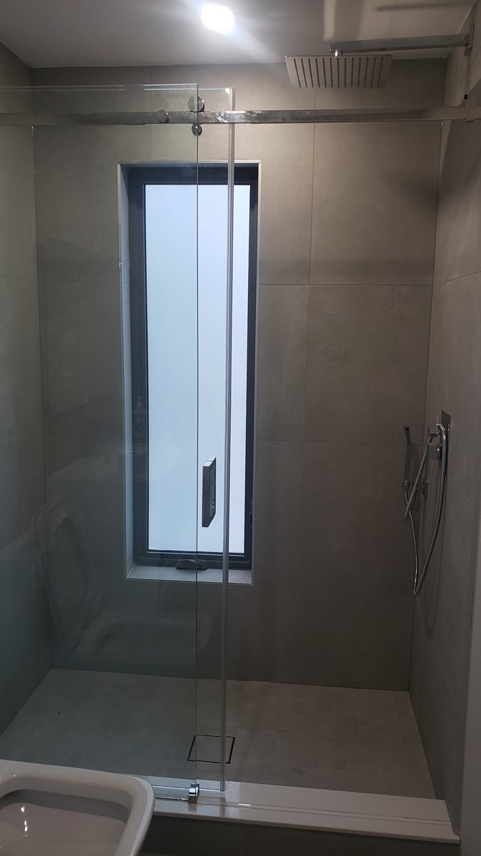 Tiled shower with privacy window