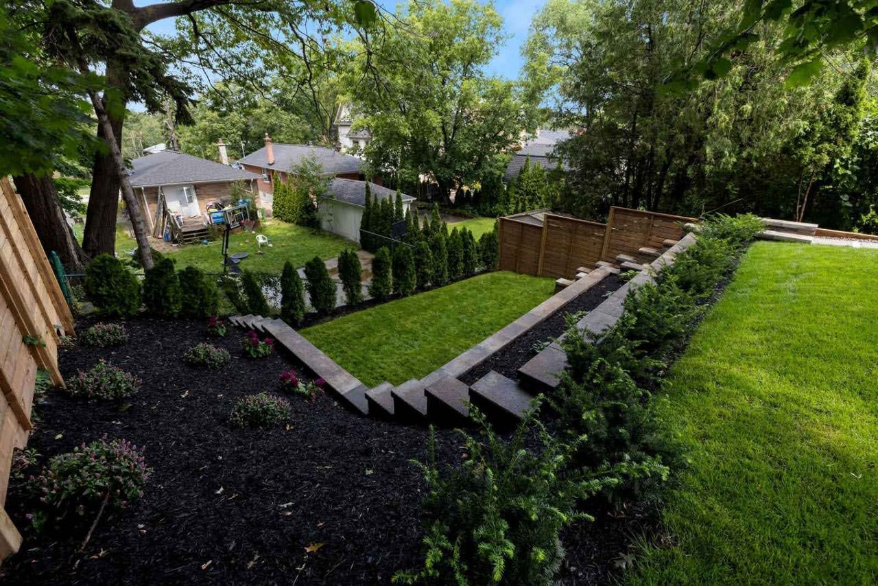 Multilevel backyard landscaping with stone steps — 42 Cannon Rd