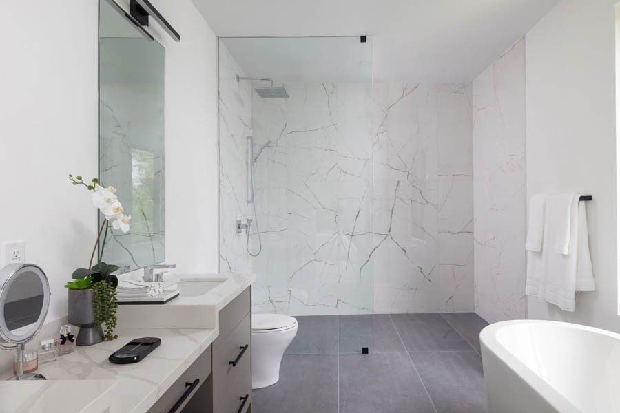 Bathroom with marble tile and freestanding tub