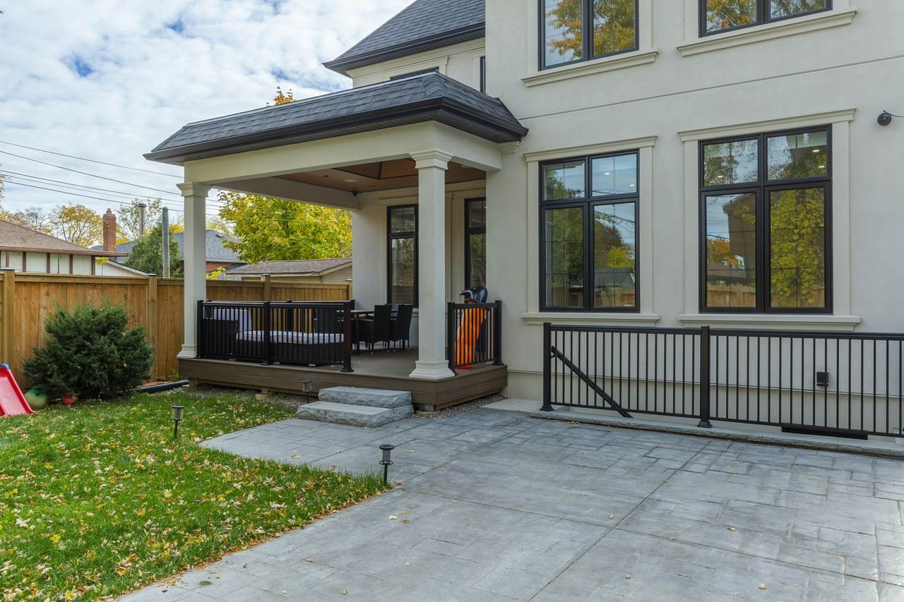 Covered rear patio with stamped concrete