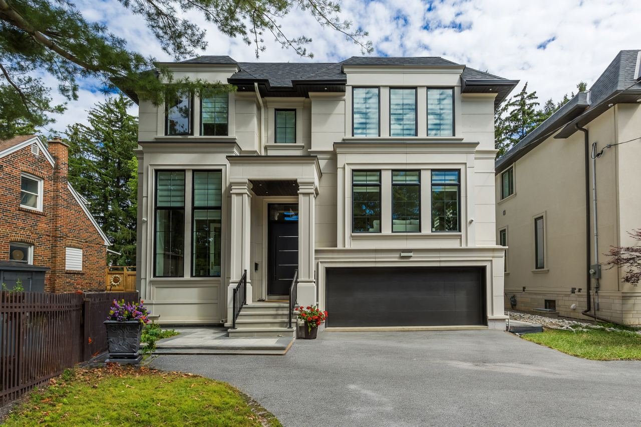 New custom home front elevation with double car garage — 50 Laurelcrest, North York