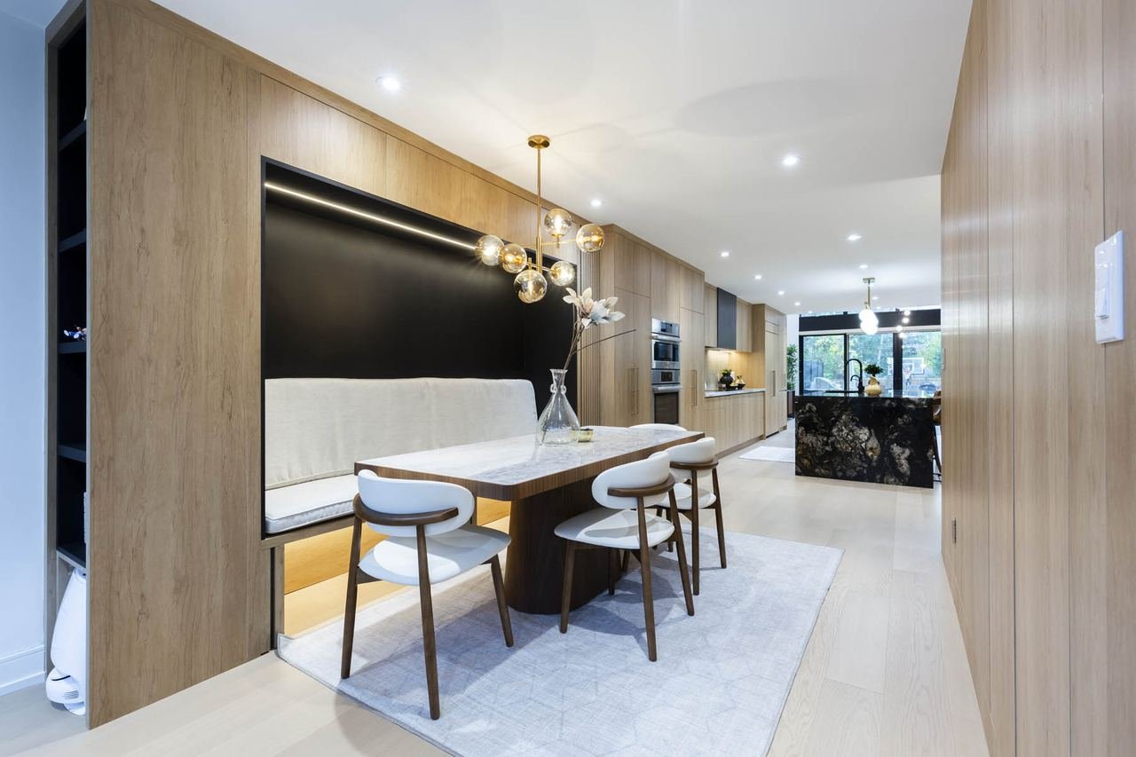 Panelled dining banquette with view to kitchen