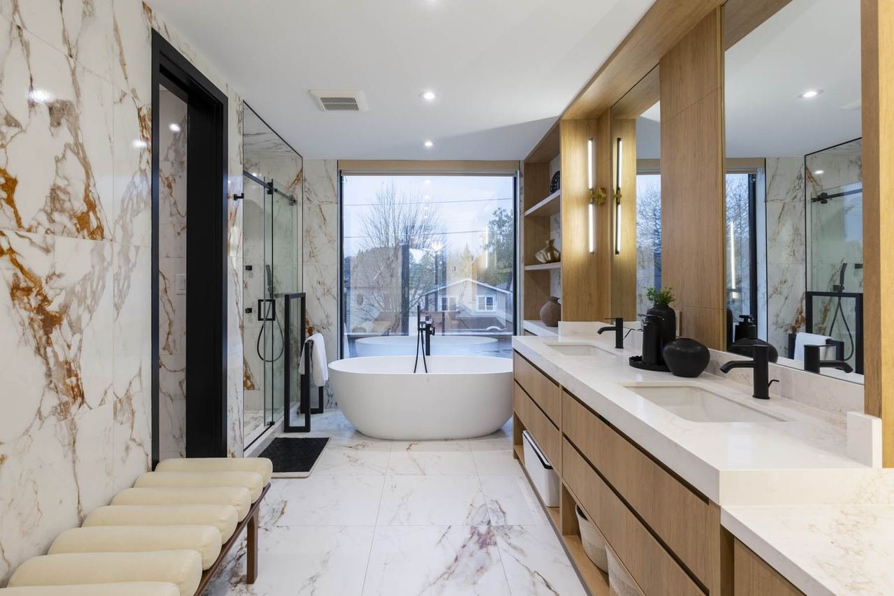 Ensuite with freestanding tub, vanity and window