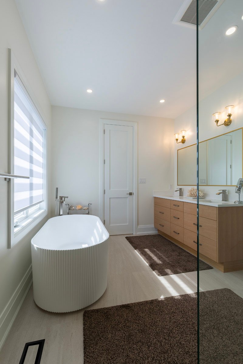 Bathroom with freestanding tub and window