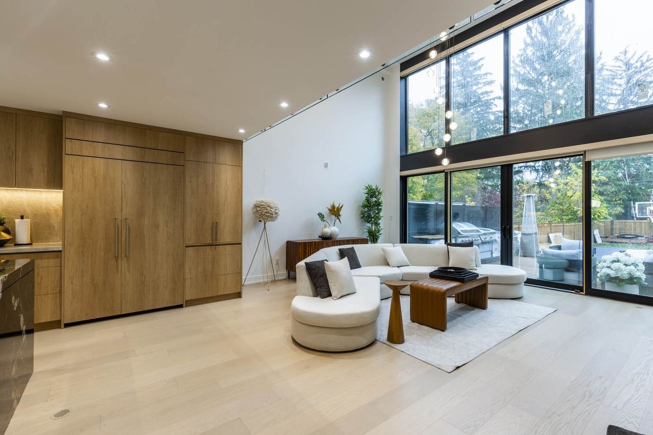 Living room with full height fiberglass and steel windows