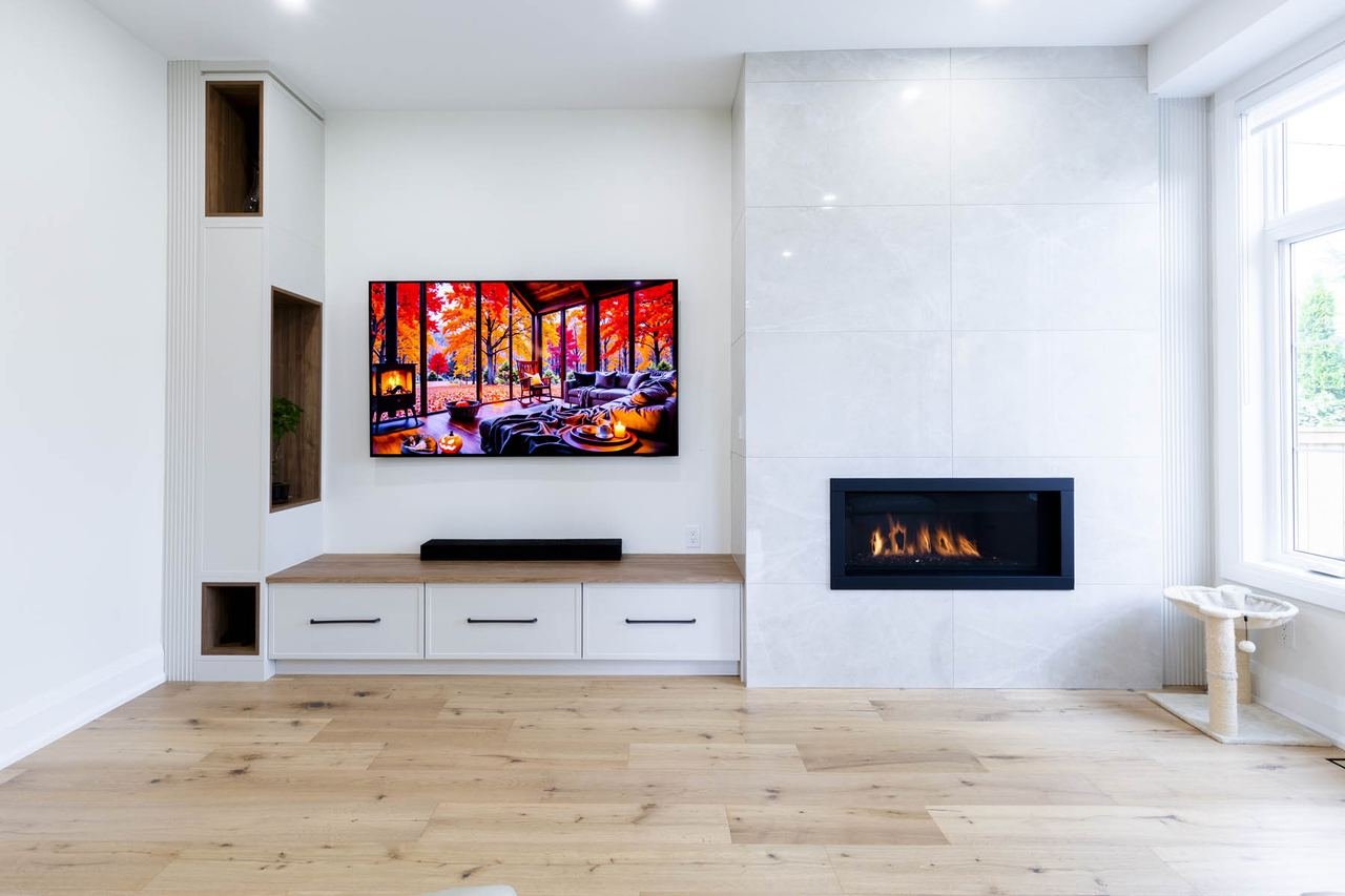 Living room media wall with fireplace and built-in cabinetry
