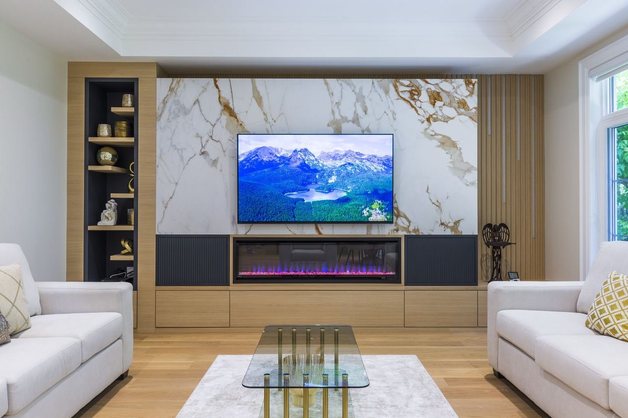 Living room media wall with marble, LED fireplace and built-in shelving