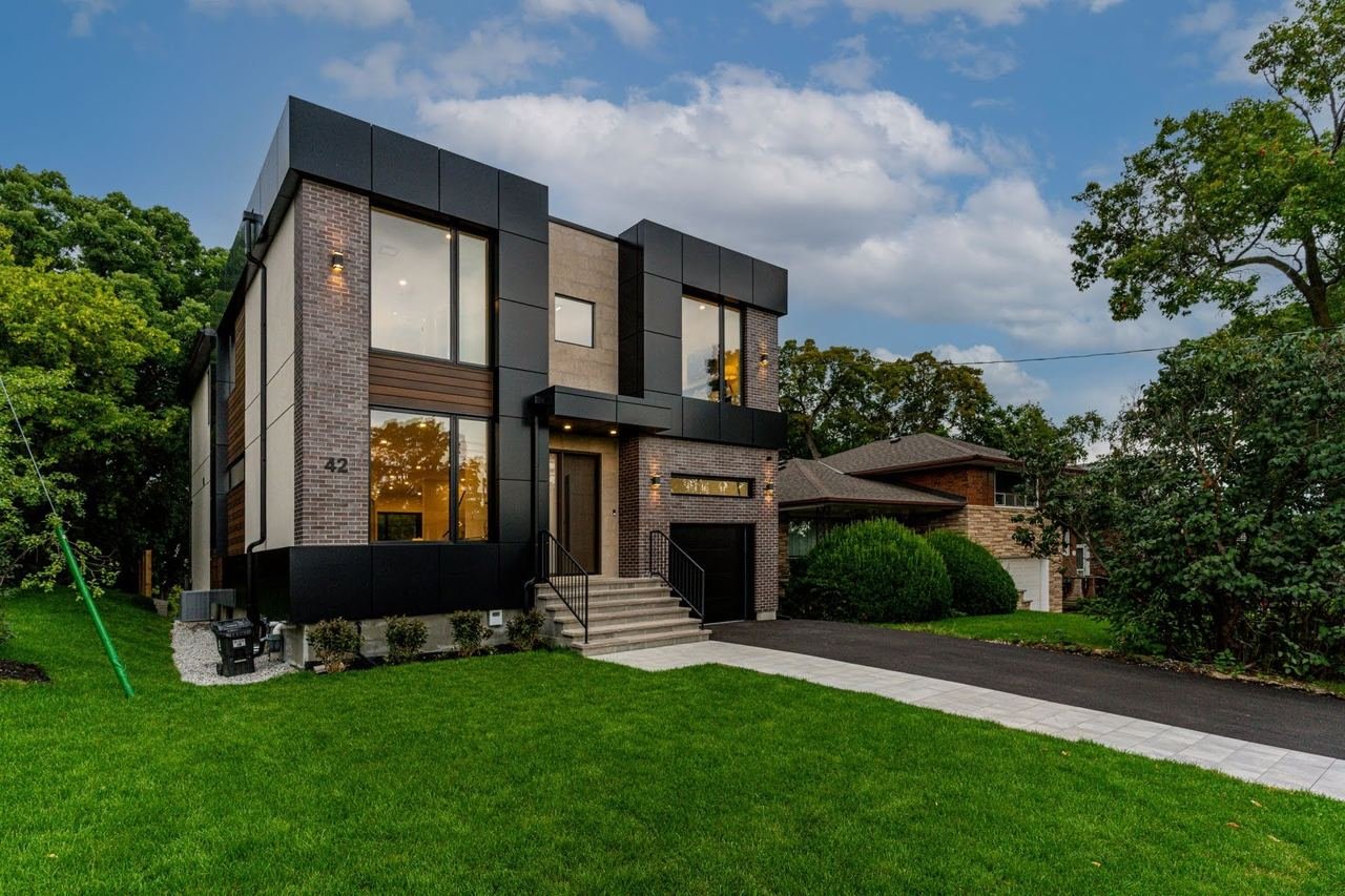 Modern new home front angle with landscaped lawn — 42 Cannon Rd