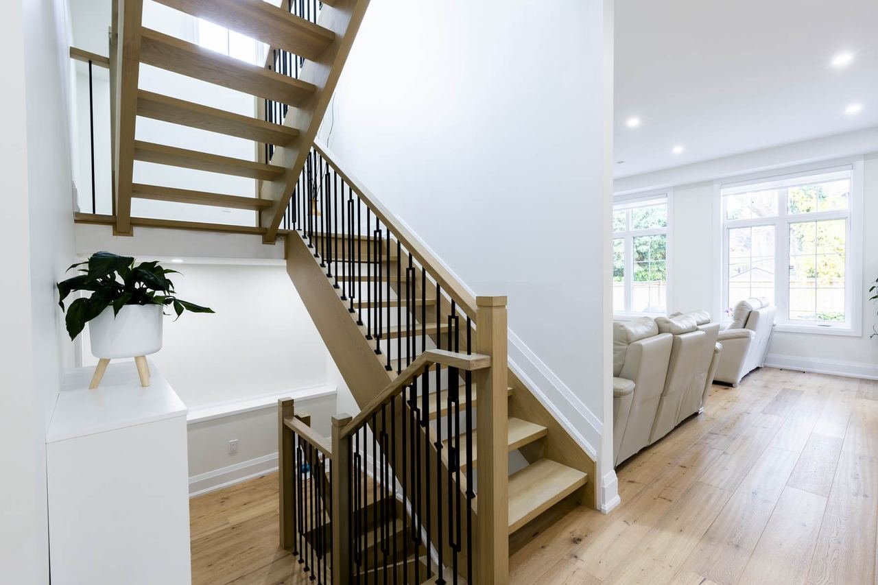 Open oak staircase with metal spindles