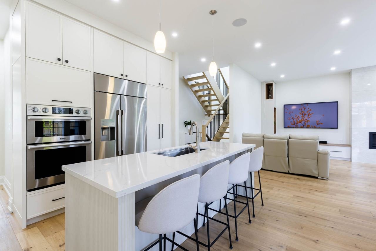 Open concept kitchen and living room with 10 foot ceilings