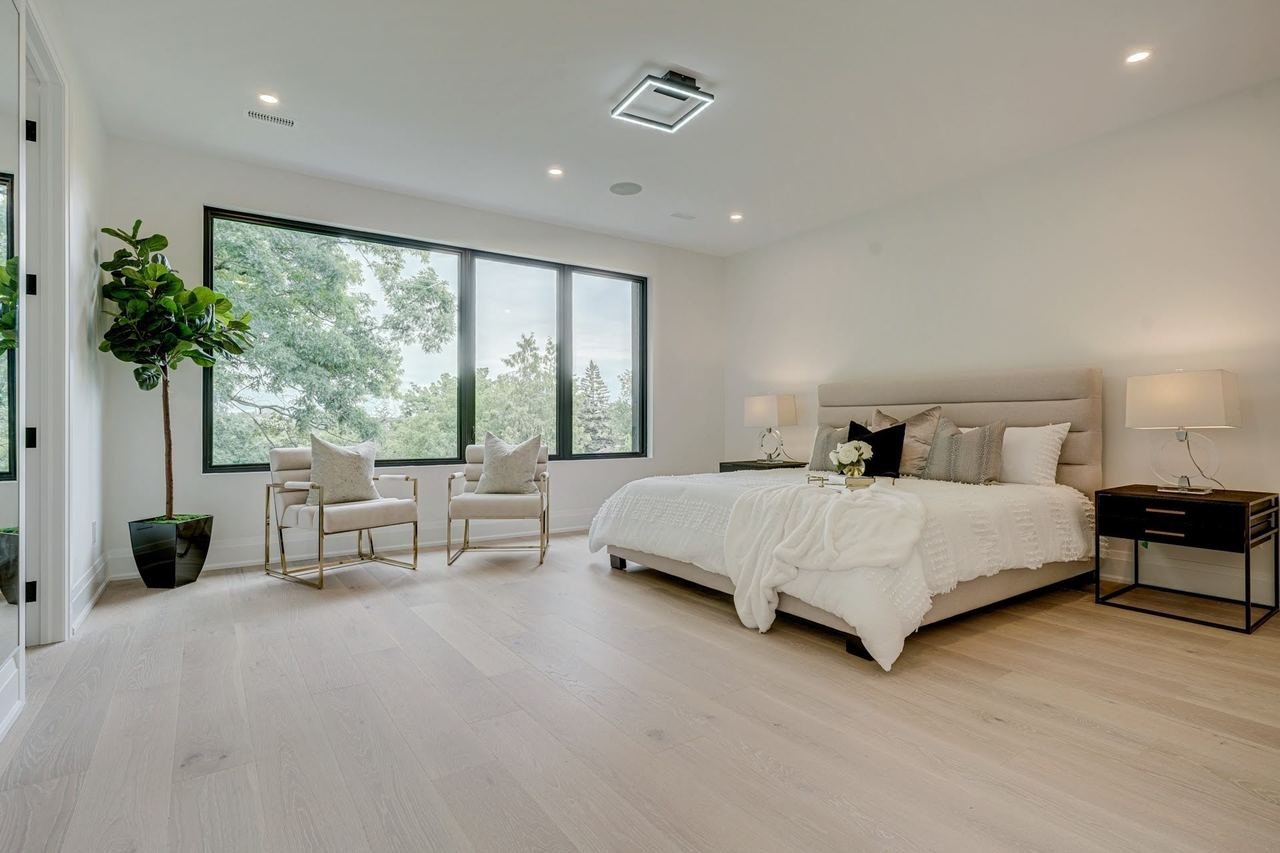 Primary bedroom with large windows