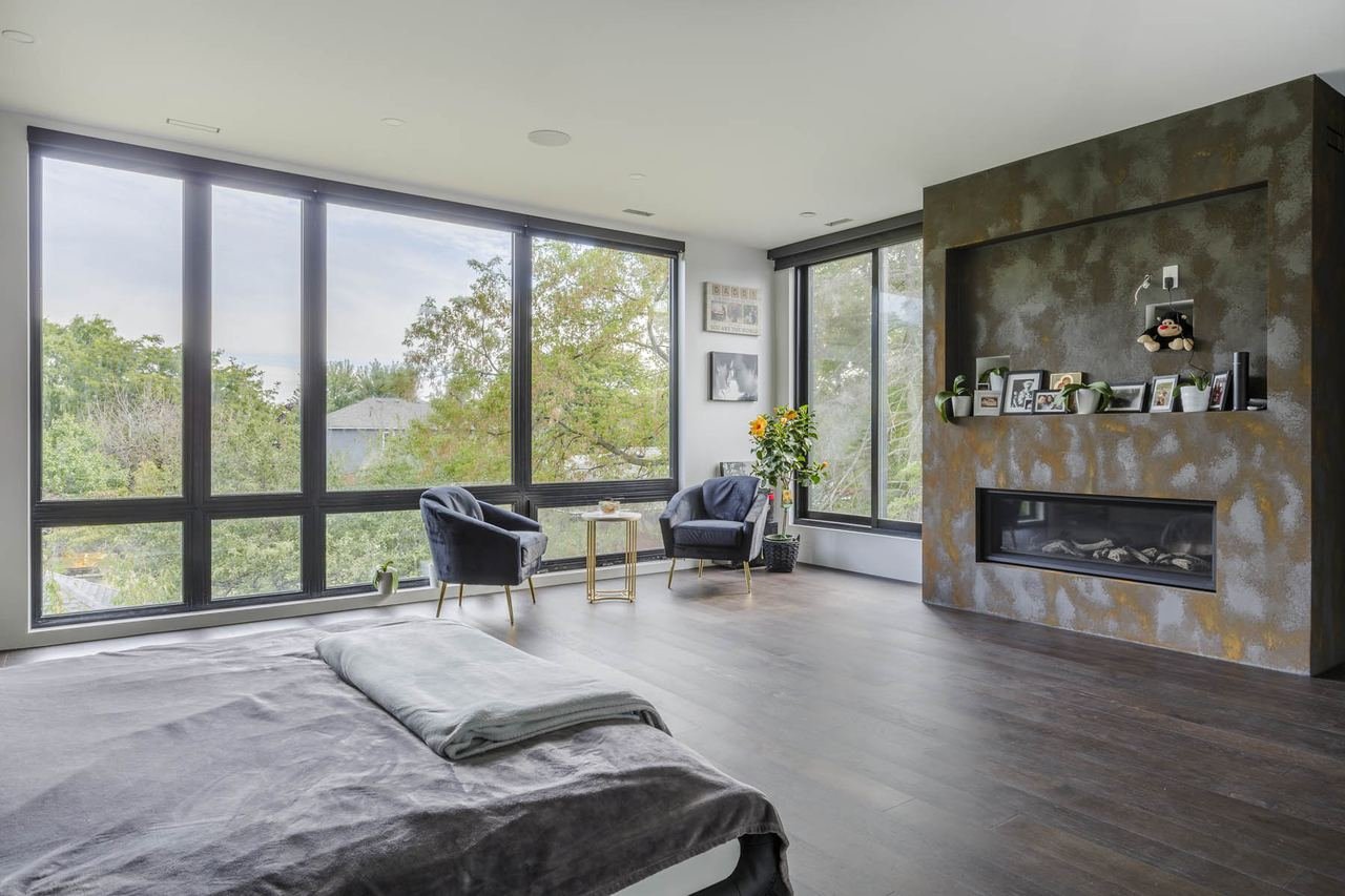 Primary suite with fireplace lounge and panoramic windows