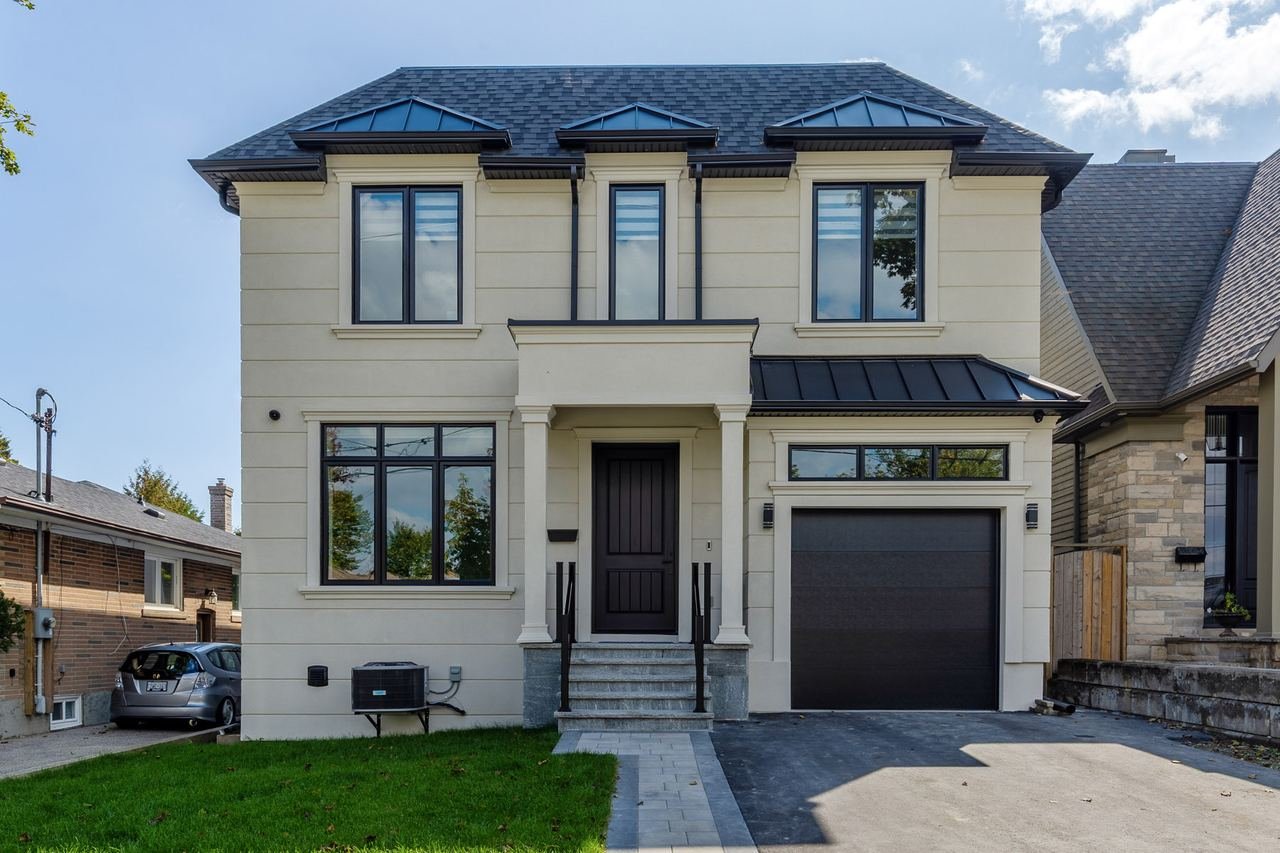 Traditional design build new home front elevation with single car garage on Cloverhill Rd, South Etobicoke