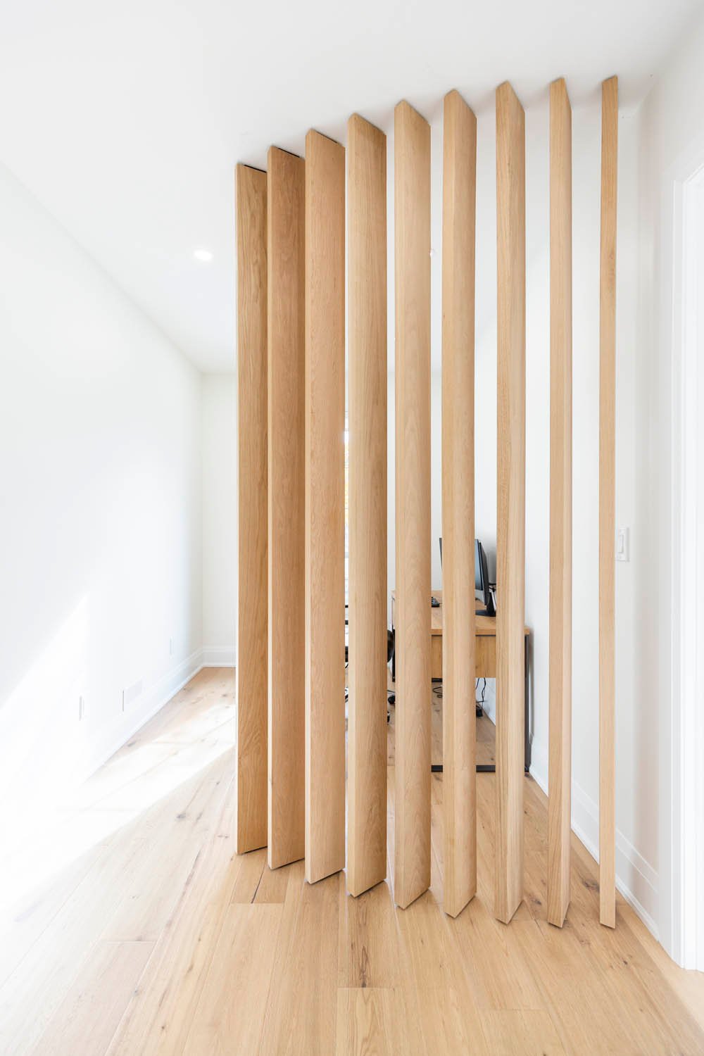 Wood slat feature partition on main floor