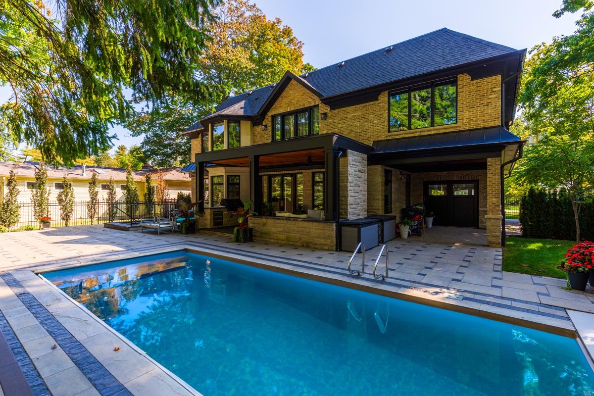 Landscaped backyard with pool and rear elevation — Oakes Dr