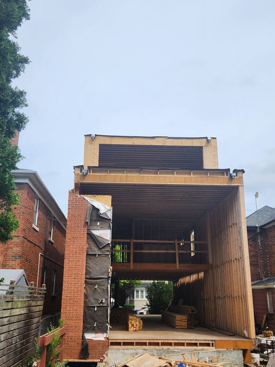 Rear elevation of the gutted structure showing the new framing and second-storey addition