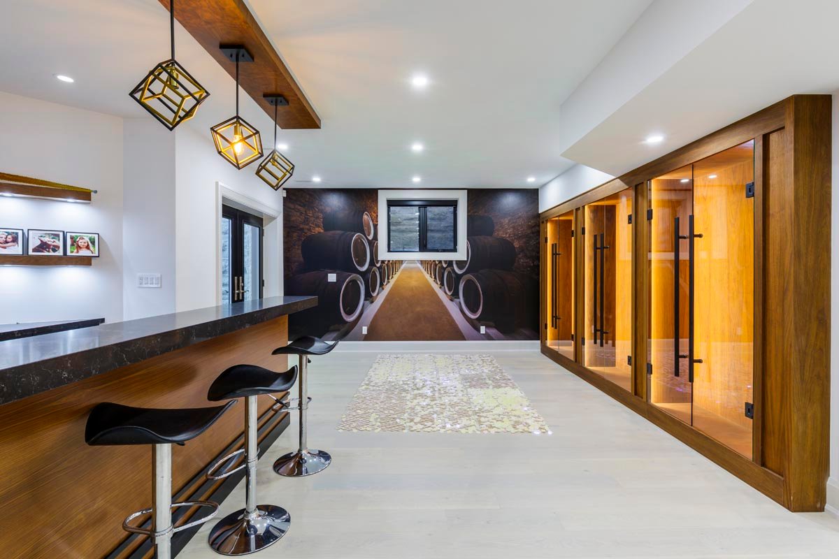 Modern basement home bar with wood cabinetry