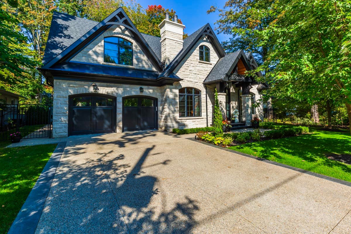Traditional stone design-build home with high pitch roof, double car garage and heated driveway — Oakes Dr, Mineola, Mississauga