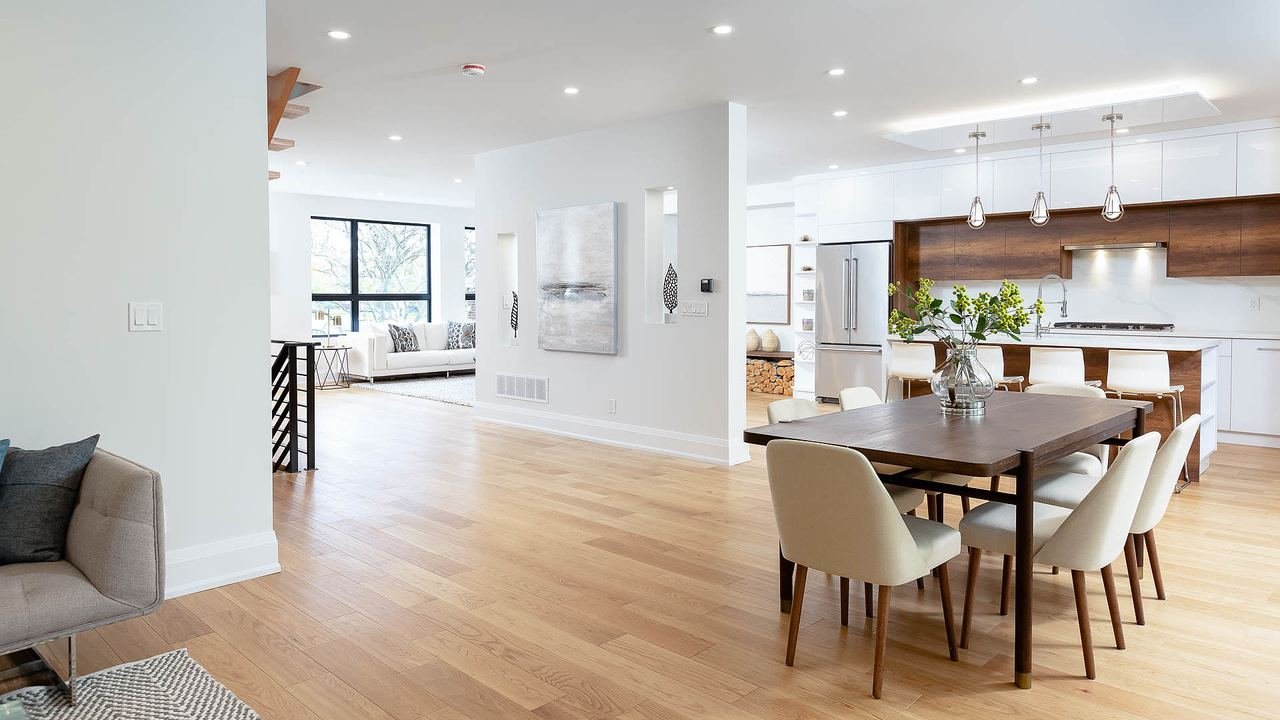 Dining area open to the kitchen with hardwood floors