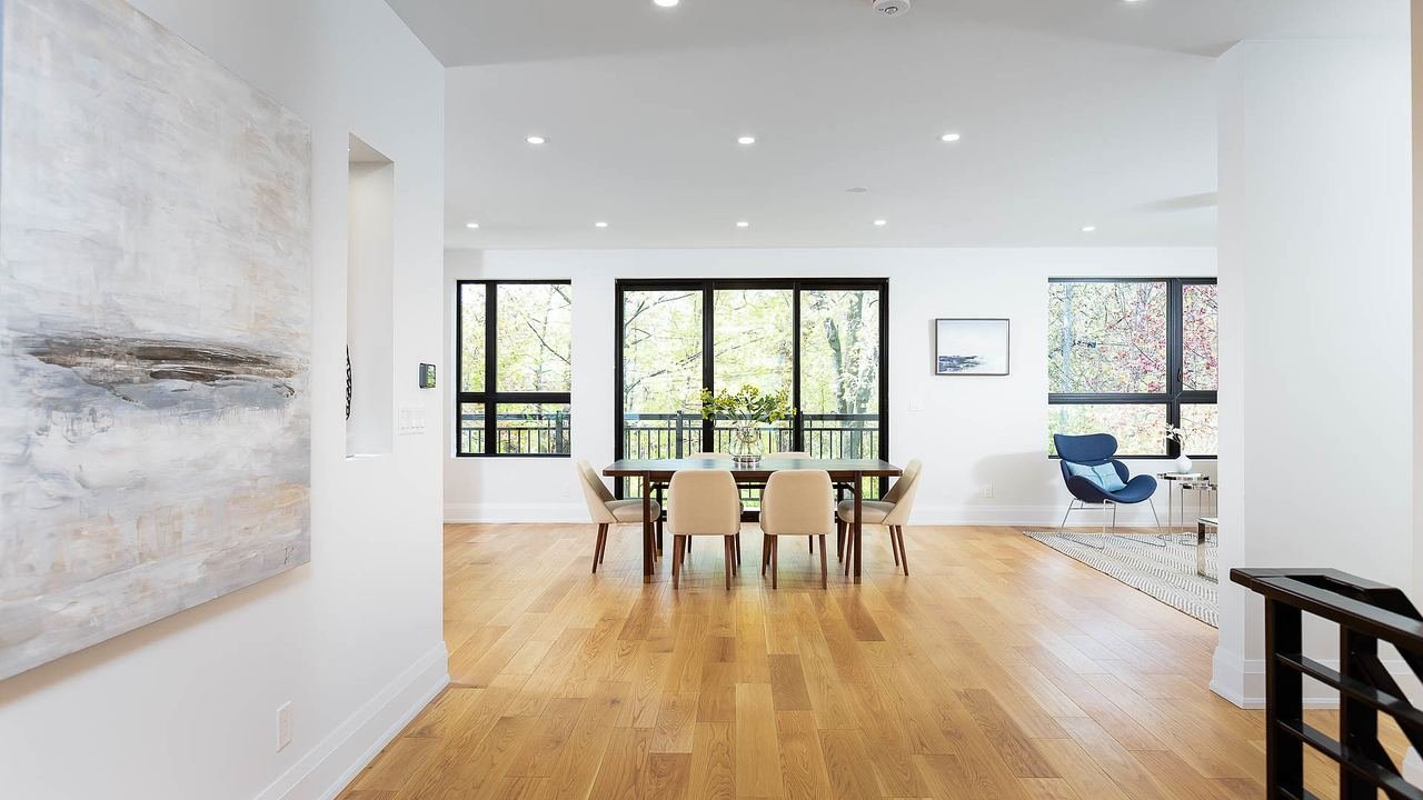 Dining room with large windows and modern art