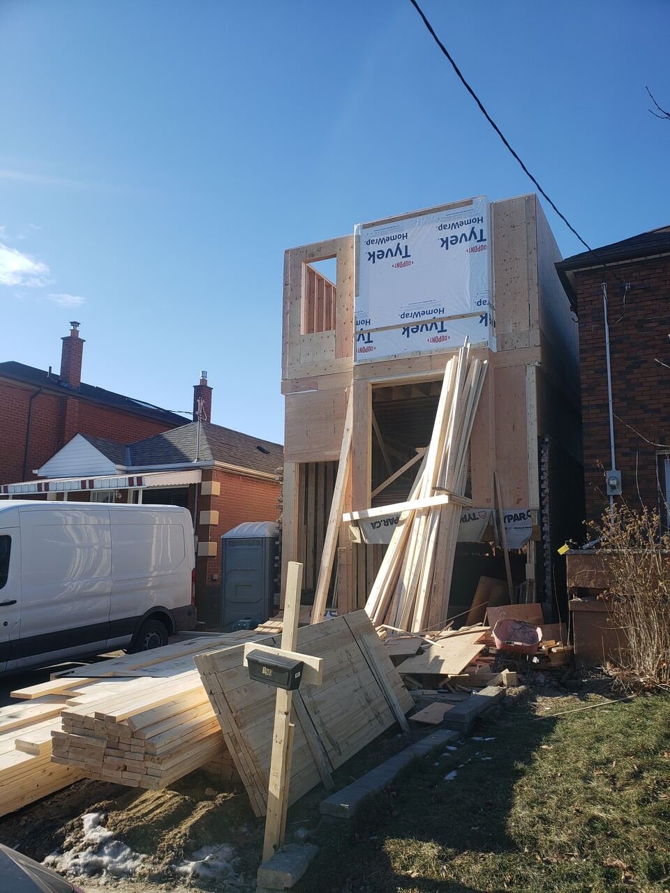 Second storey addition framed with house wrap installed