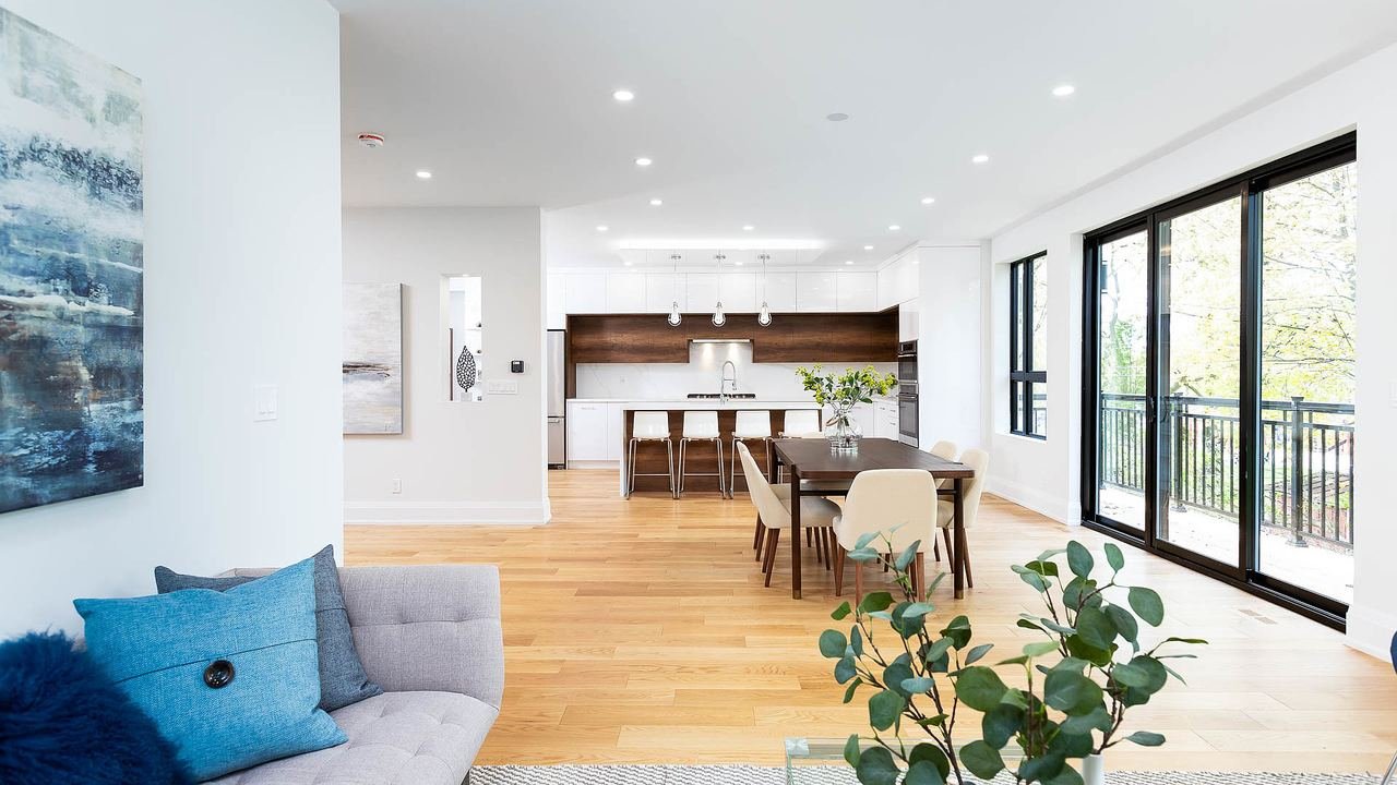 Family room with balcony walkout open to the kitchen