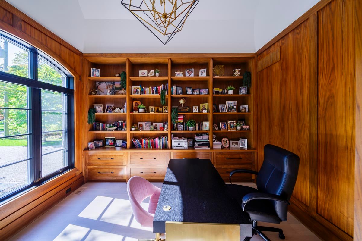 Home office with custom wood library built-ins