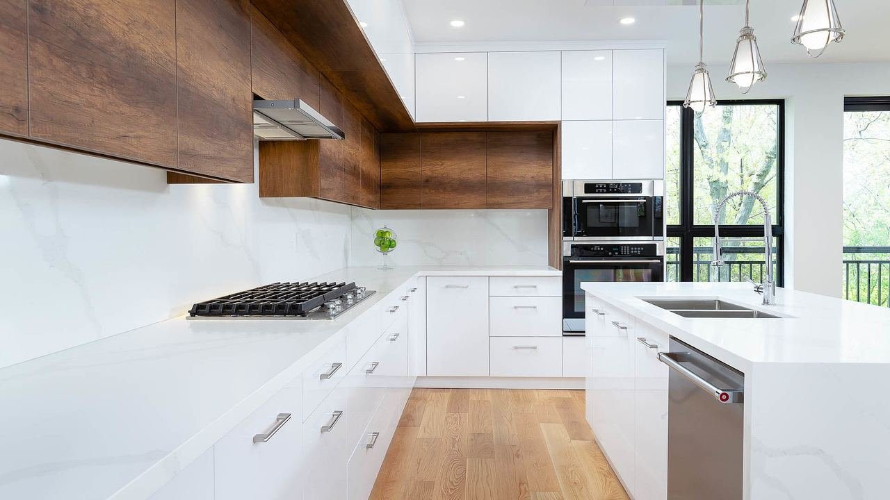 Kitchen with gas cooktop, quartz counters and black-framed windows