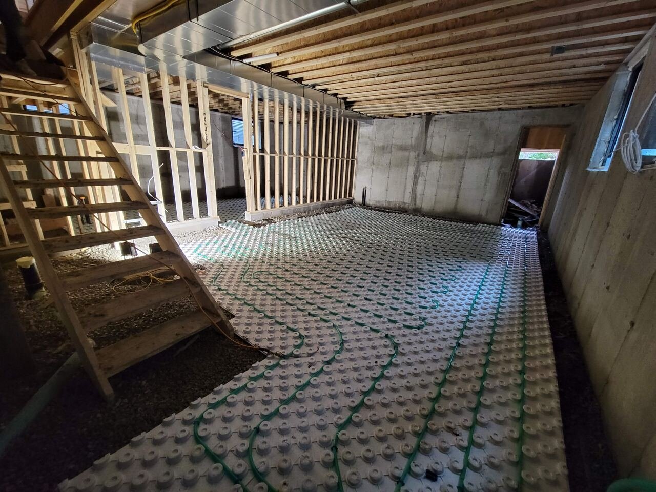 Basement during construction with in-floor radiant heating tubing installed