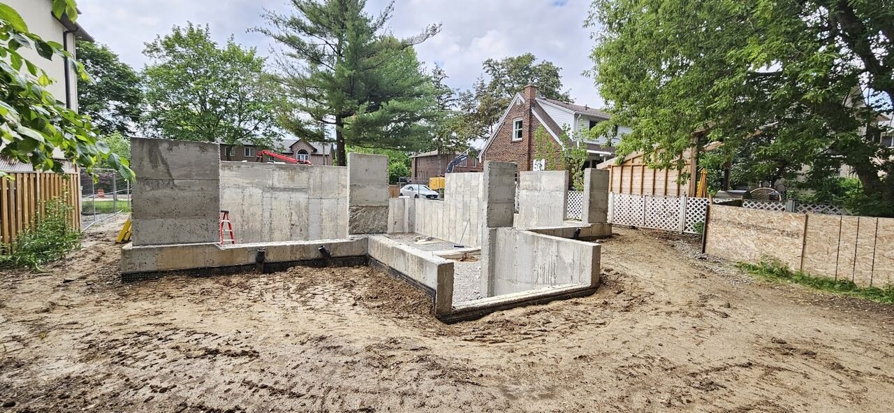 Poured concrete foundation walls and footings before framing begins