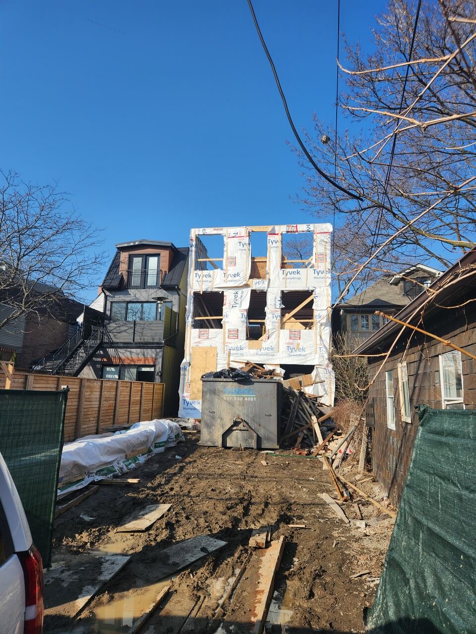 Three storey rear framing wrapped in house wrap