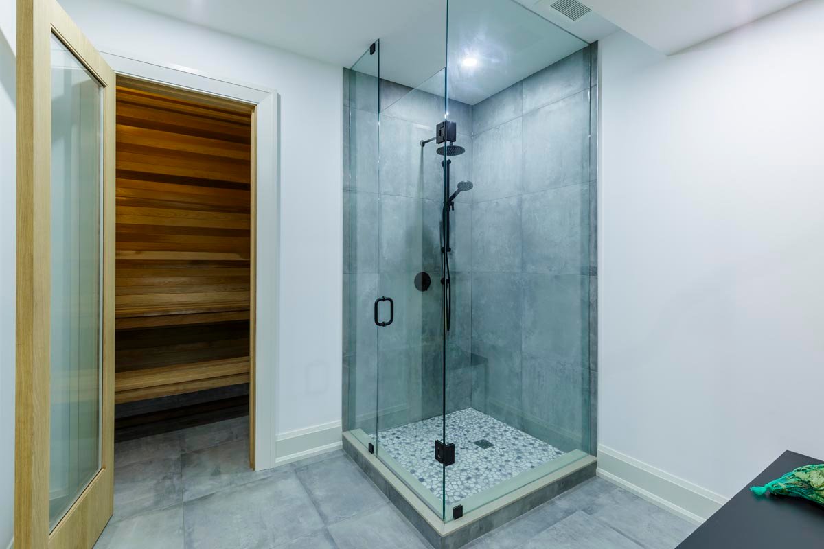 Basement sauna with glass shower