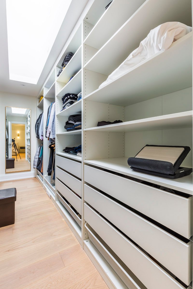 Walk-in closet with custom organizers, drawers and full length mirror