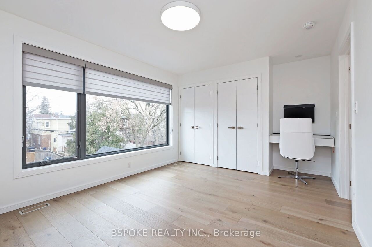 Bedroom with double closets and built-in desk nook