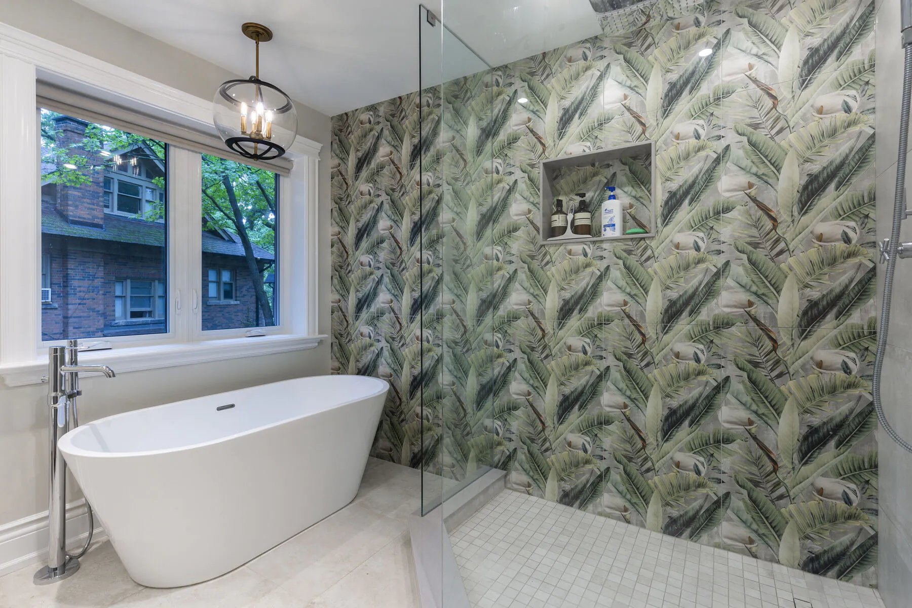 Bathroom with freestanding tub and patterned tile shower
