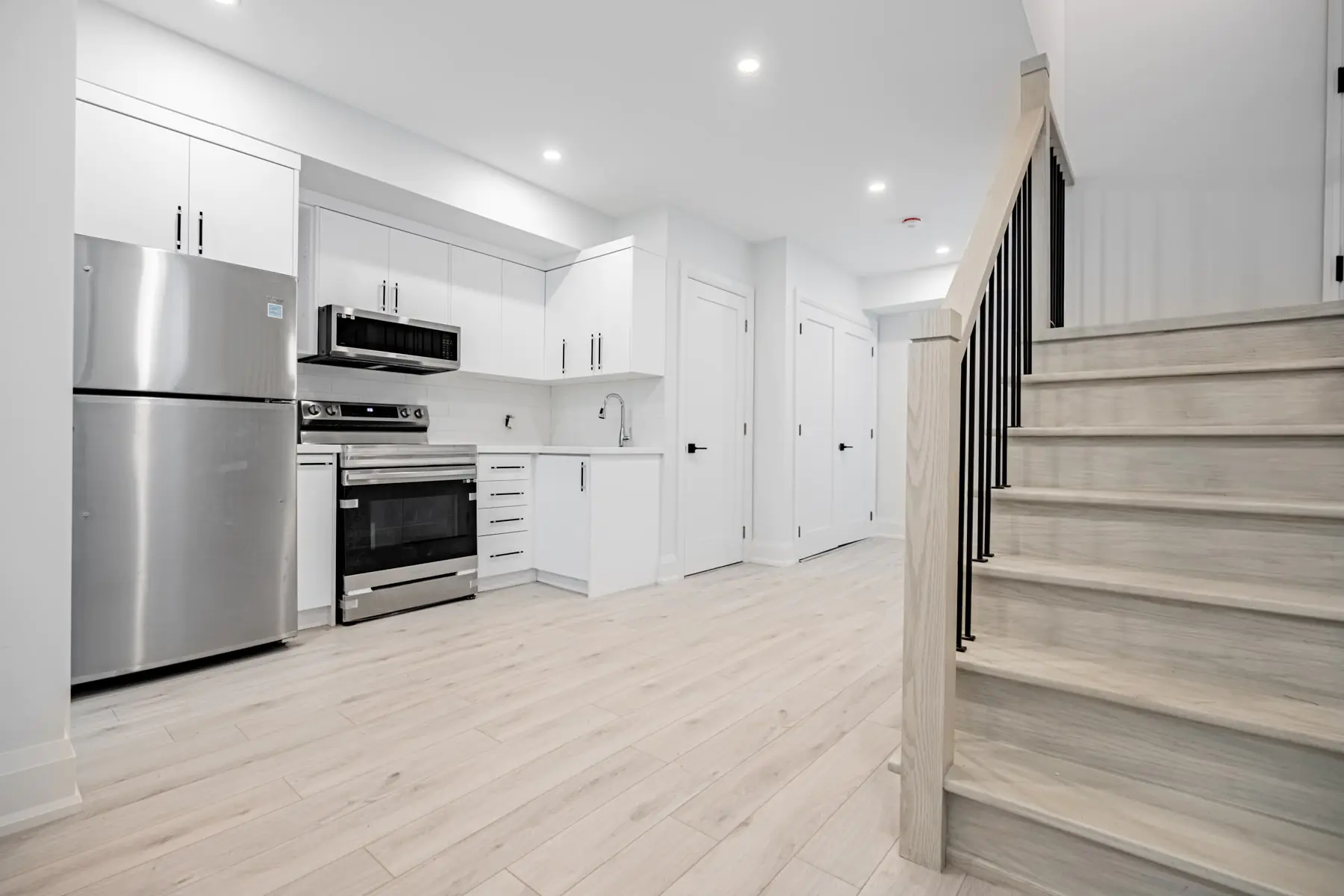 White kitchen with stainless steel appliances