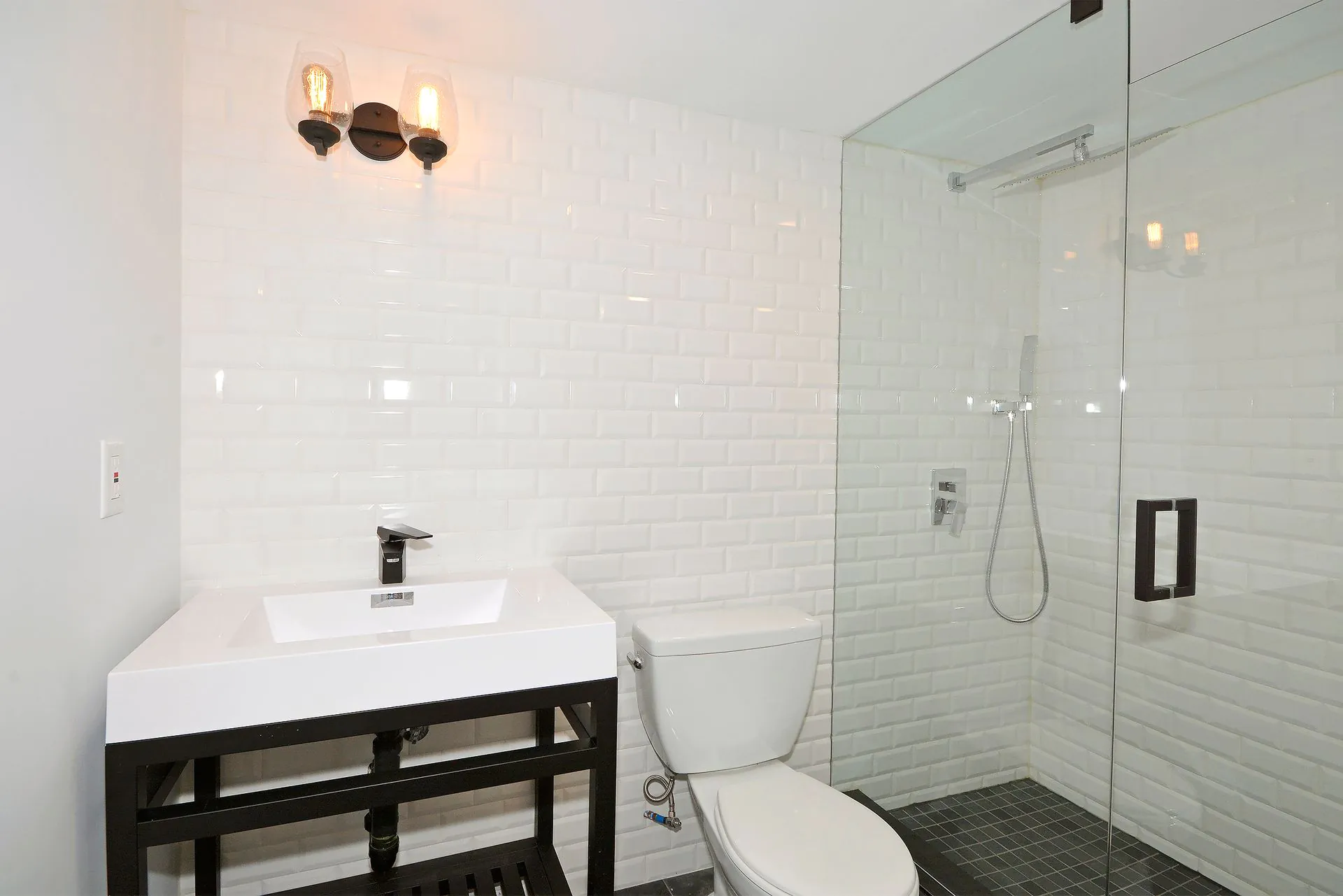 Basement bathroom with subway tile shower