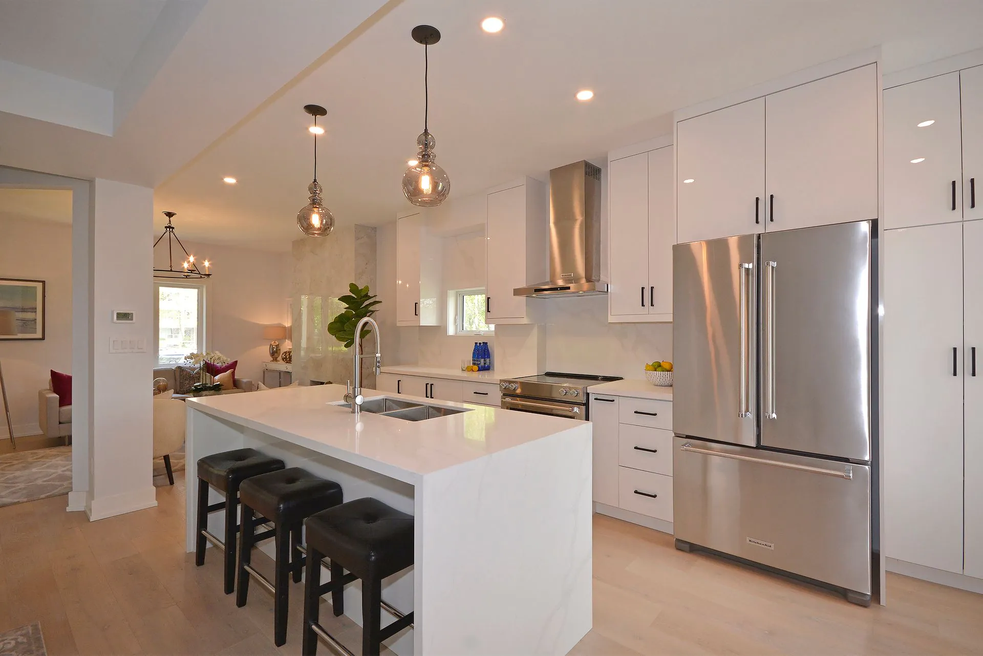 Renovated white kitchen with island in High Park North