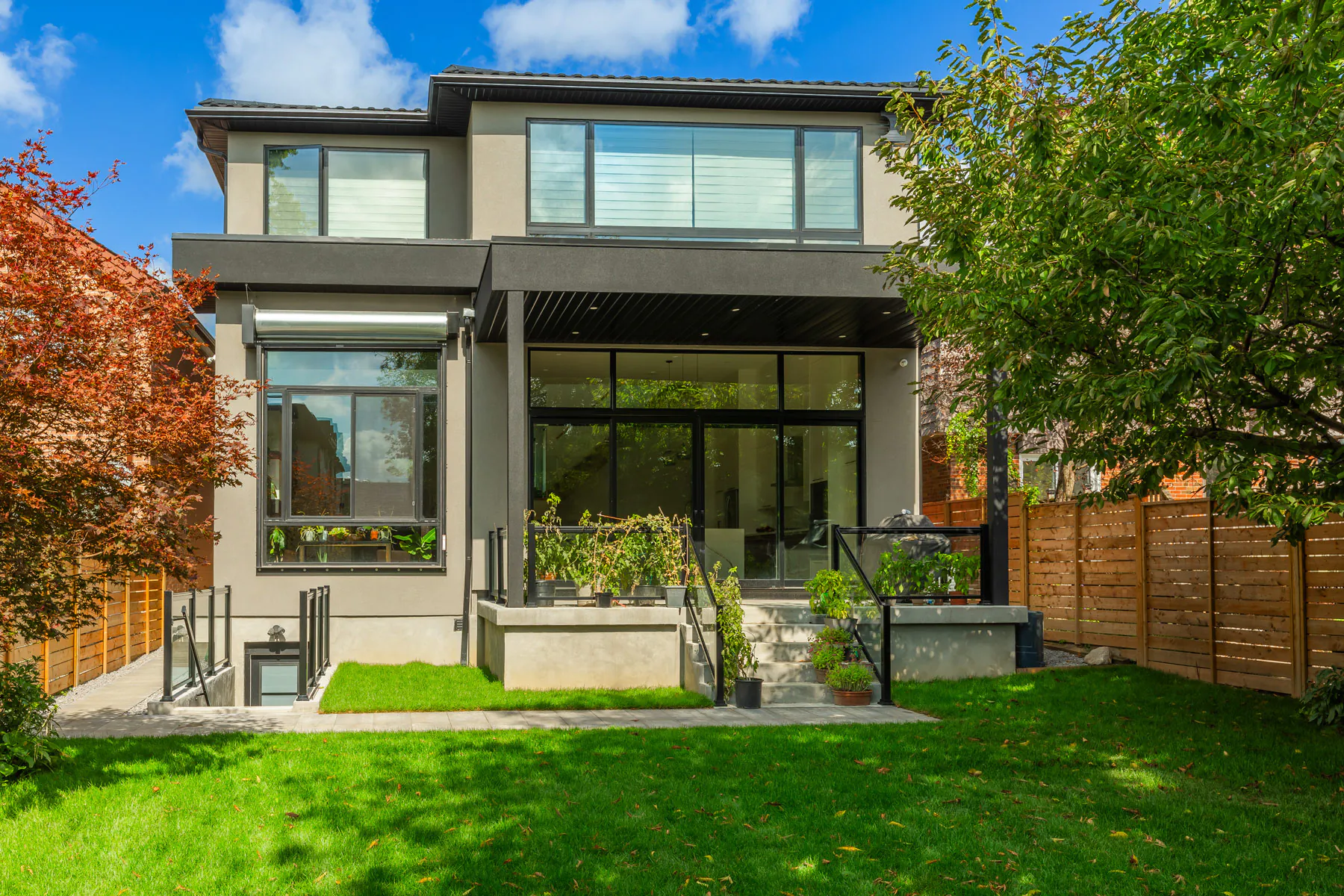 Rear exterior and backyard of the new home
