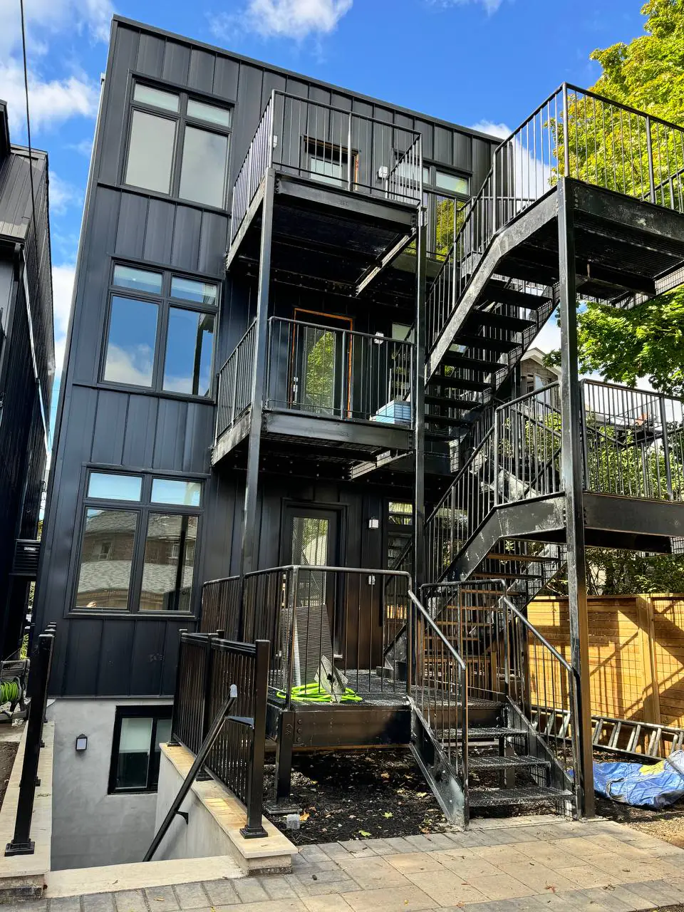 Exterior Rear Black Cladding Spiral Staircase