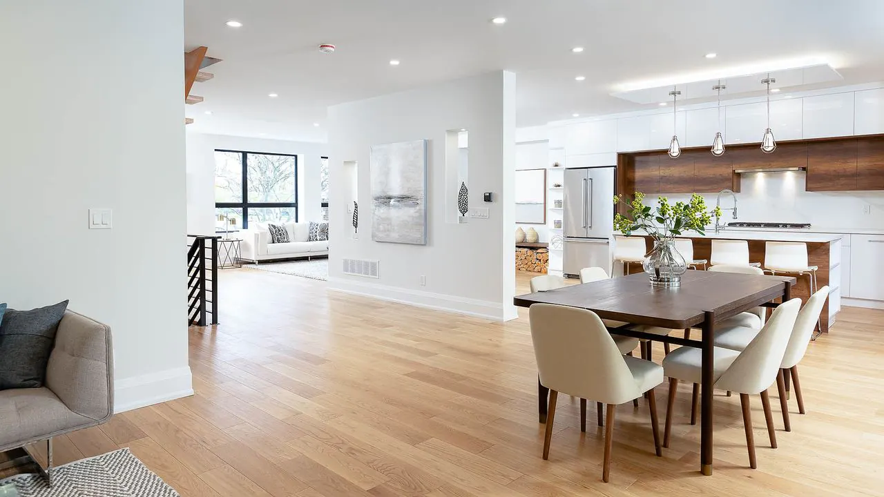 Dining area open to the kitchen with hardwood floors